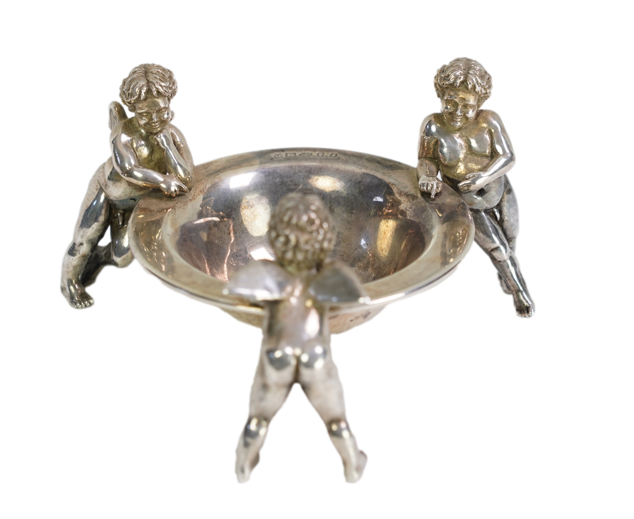 An Elizabeth II Theo Fennell silver bonbon bowl, with three cherub supports